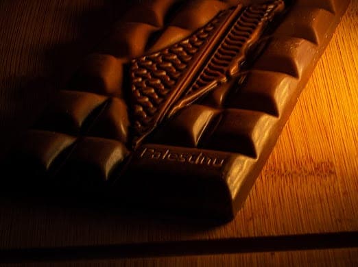 A Palestinu dark chocolate bar, embossed with an olive branch